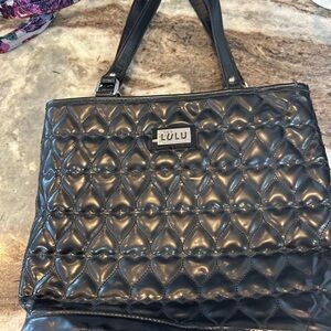 Lulu Guinness patent leather Heart Tote has a bit of wear cracking on straps